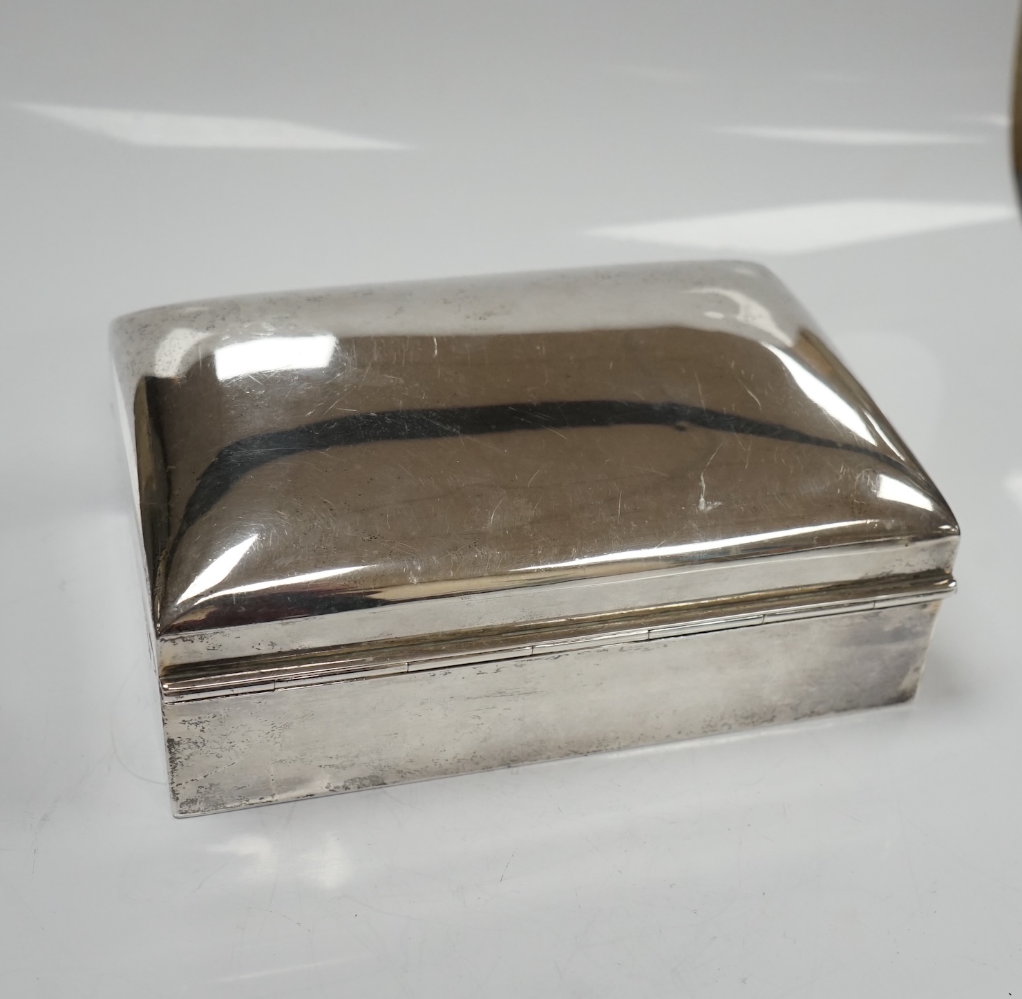 Two silver cigarette boxes, the largest by Stokes & Ireland, Chester, 1906, 14.7cm. Condition - poor to fair